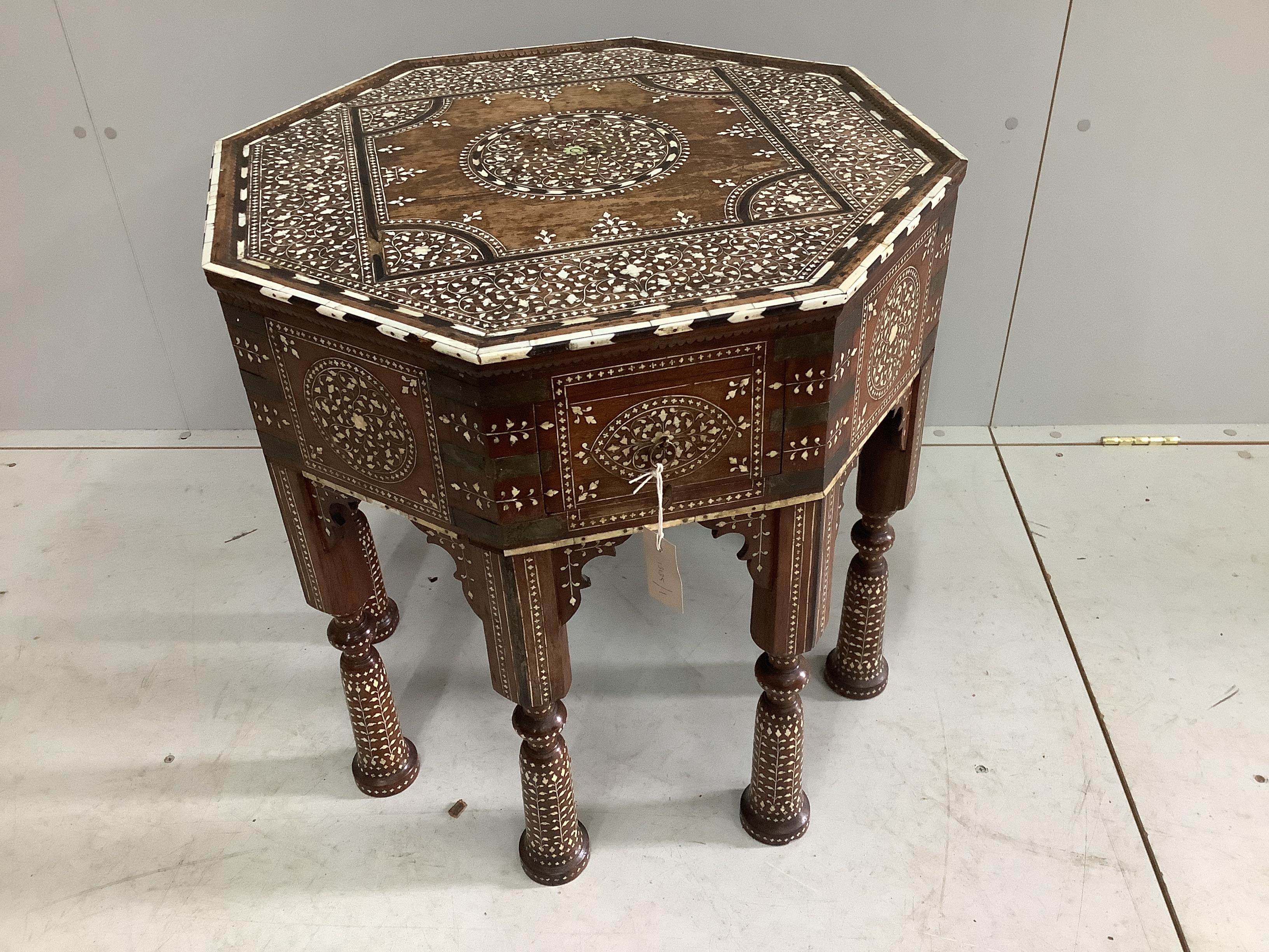 A 19th century Indian Hoshiarpur brass mounted octagonal bone inlaid table, fitted two drawers on turned legs, width 62cm, height 62cm